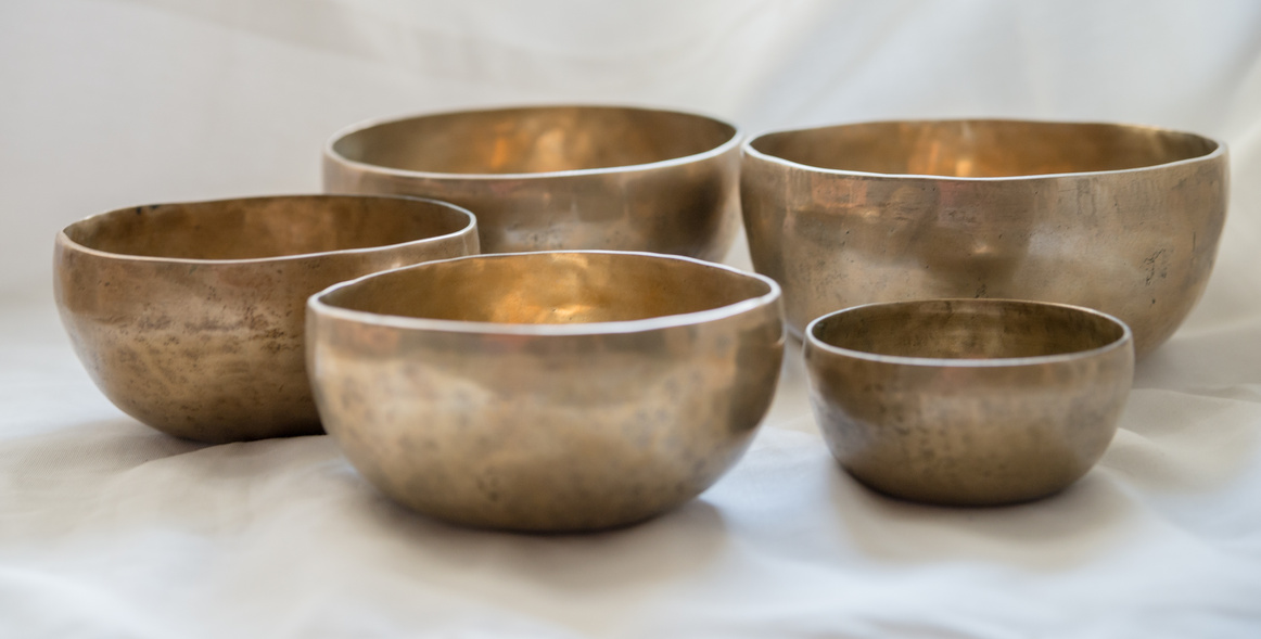 Tibetan sound bowls bright background